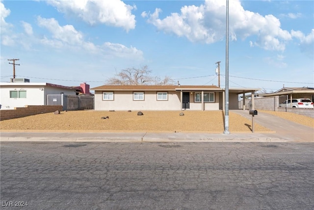 view of front of property featuring a carport