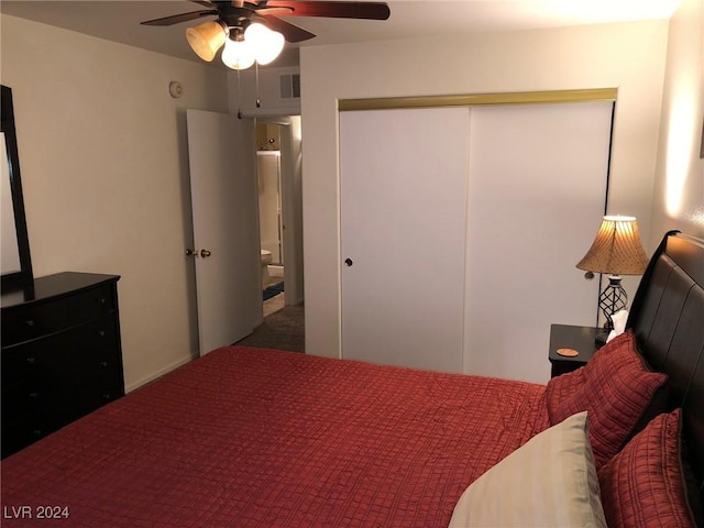 bedroom featuring ceiling fan and a closet