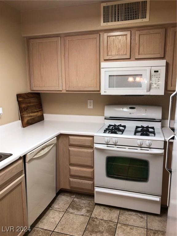 kitchen featuring white appliances