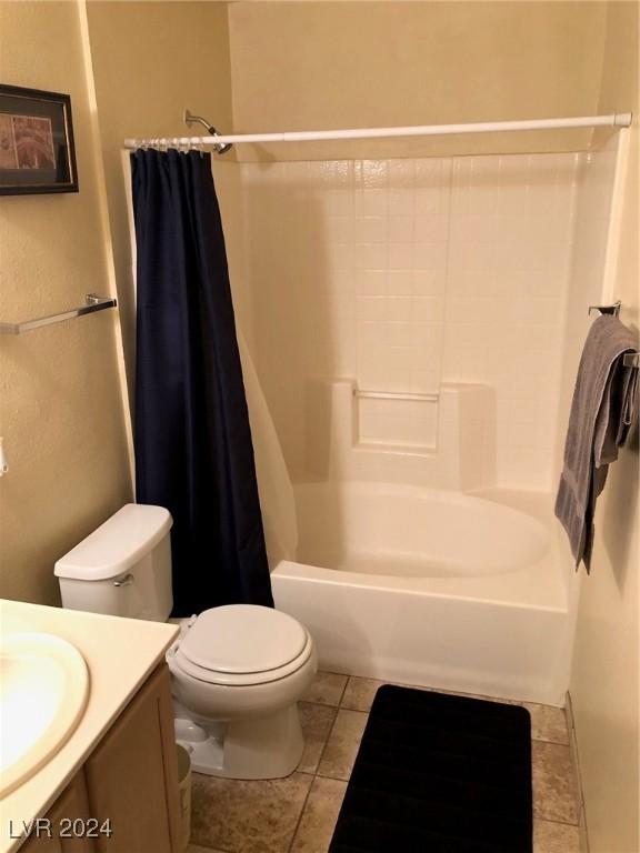 full bathroom with toilet, tile patterned floors, vanity, and shower / bathtub combination with curtain