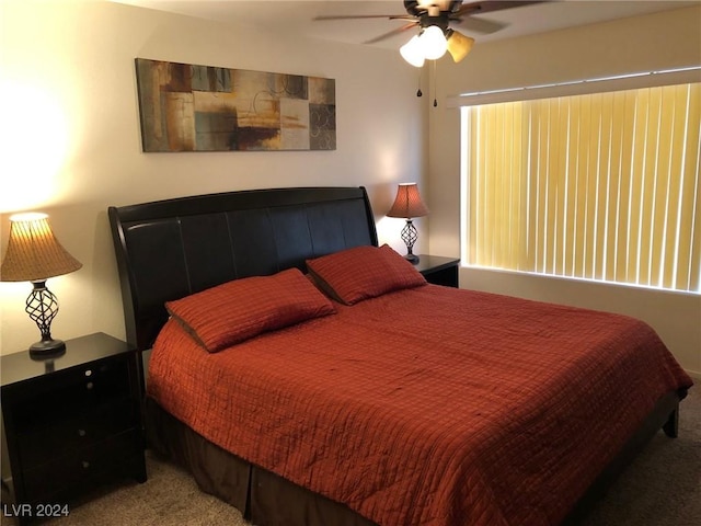 bedroom with ceiling fan and carpet flooring