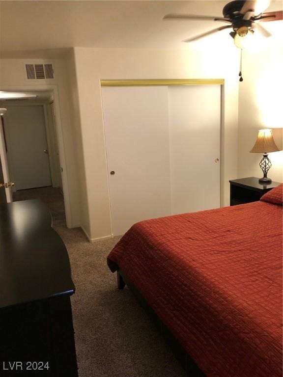 bedroom featuring a closet, ceiling fan, and carpet