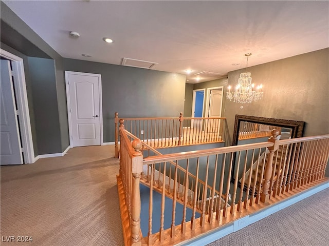 interior space with a chandelier and carpet floors