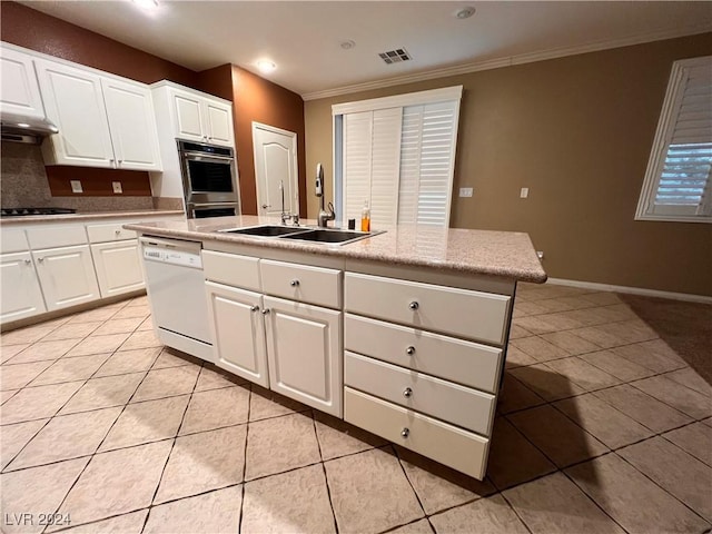 kitchen featuring dishwasher, a center island with sink, white cabinets, and sink