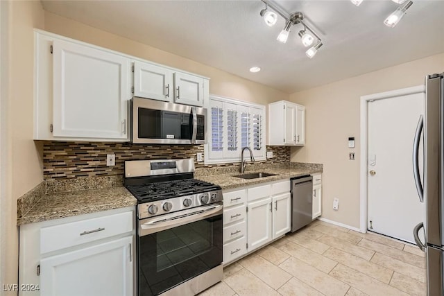 kitchen featuring white cabinetry, sink, and appliances with stainless steel finishes