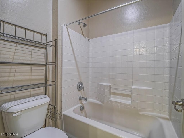 bathroom featuring toilet and bathtub / shower combination