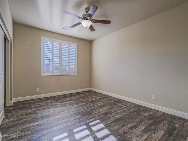 unfurnished bedroom with ceiling fan and dark hardwood / wood-style floors