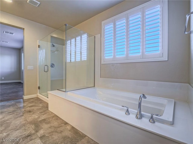 bathroom with independent shower and bath