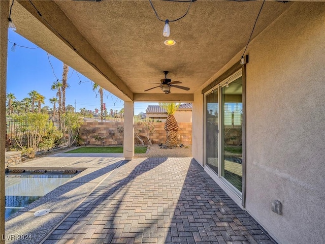 view of patio featuring ceiling fan