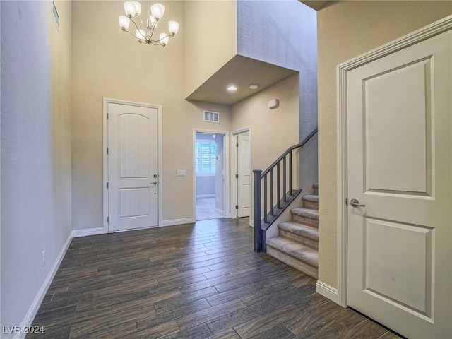 foyer featuring a chandelier and dark hardwood / wood-style floors