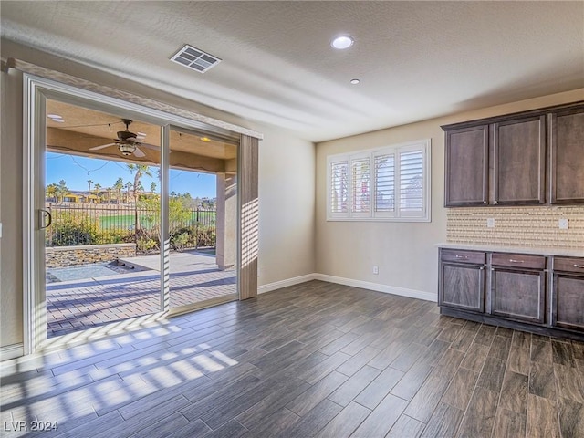 interior space with ceiling fan