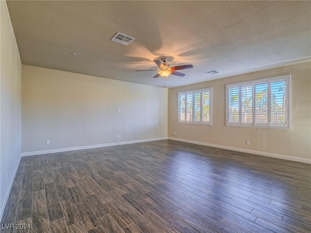 spare room featuring a textured ceiling and ceiling fan