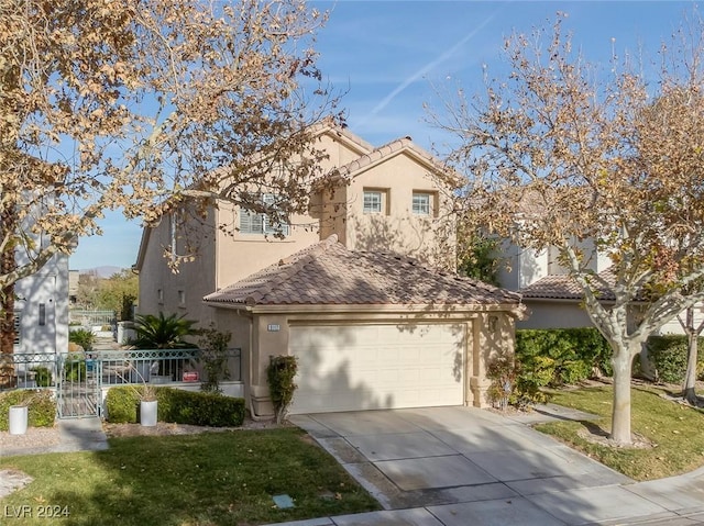 mediterranean / spanish-style home with a front lawn and a garage