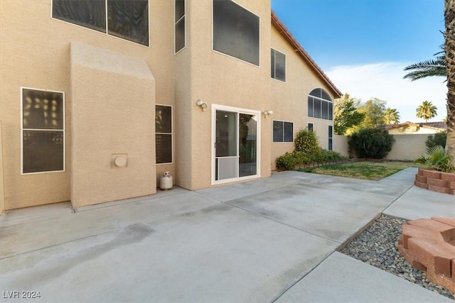 rear view of property with a patio area