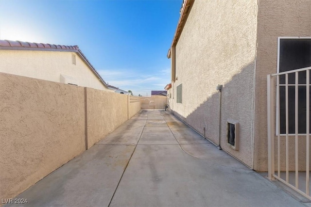 view of side of property featuring a patio area