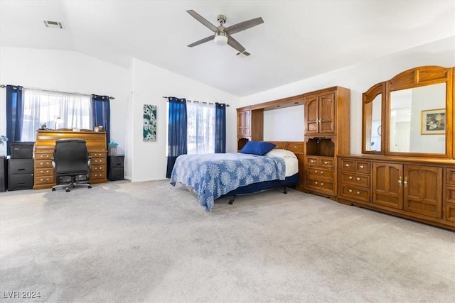 bedroom featuring ceiling fan, light colored carpet, lofted ceiling, and multiple windows