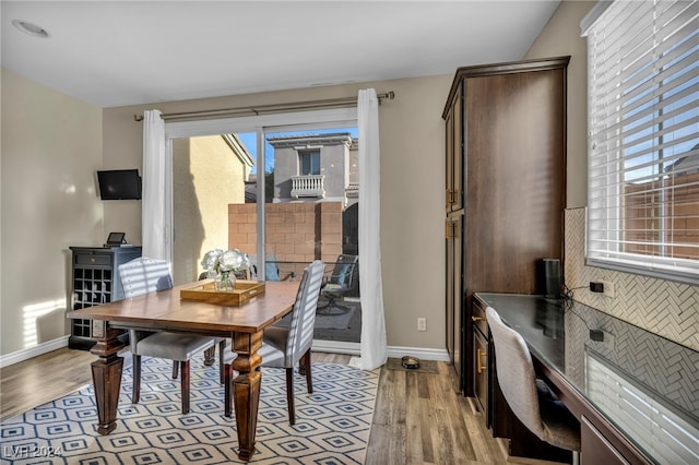 dining area with light hardwood / wood-style flooring