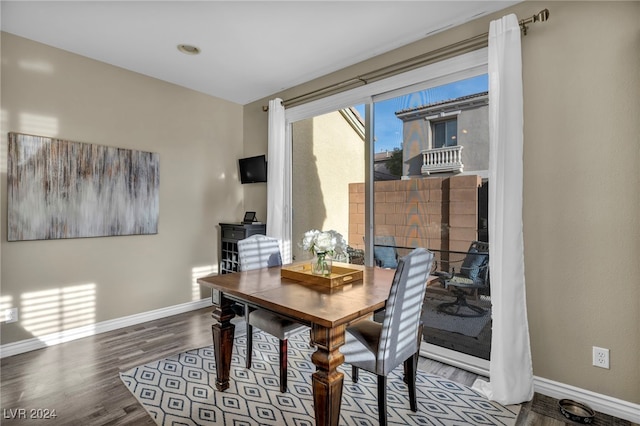 dining area featuring hardwood / wood-style floors