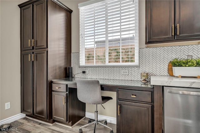 office area with built in desk and light hardwood / wood-style floors