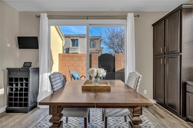 dining area featuring light wood-type flooring