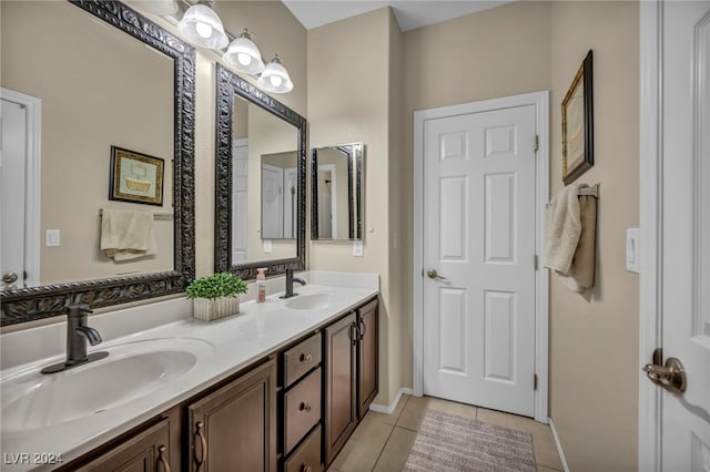 bathroom with tile patterned flooring and vanity