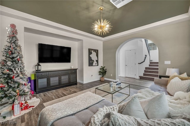 living room featuring a chandelier and hardwood / wood-style flooring