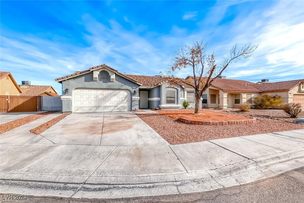 single story home featuring a garage