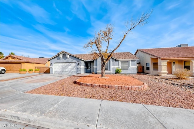 ranch-style house featuring a garage