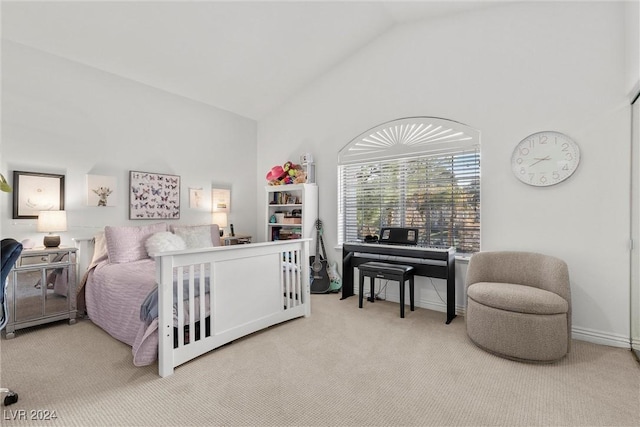 bedroom featuring lofted ceiling and light colored carpet