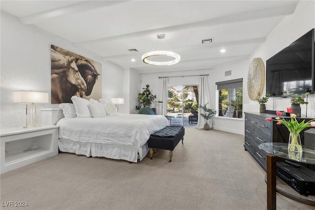 carpeted bedroom featuring beam ceiling and access to outside