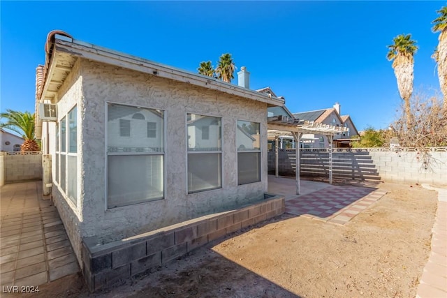 view of side of home featuring a patio