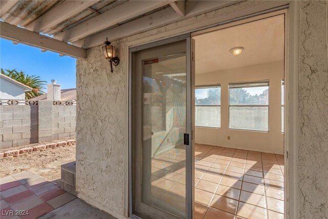 property entrance with a patio area