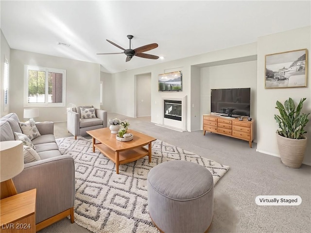 living room featuring ceiling fan and light colored carpet