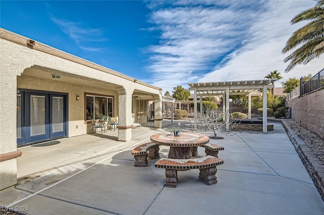 view of patio / terrace featuring french doors and a pergola