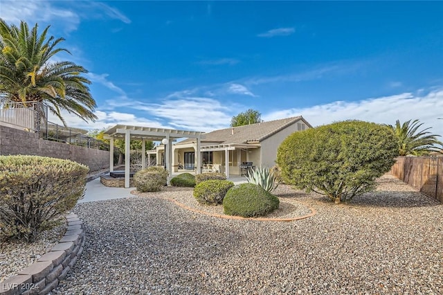 rear view of house with a pergola