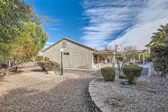 view of side of home featuring a patio