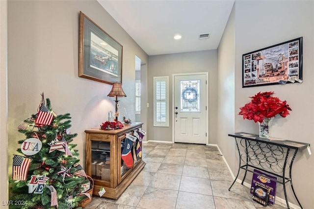 foyer entrance featuring light tile patterned floors