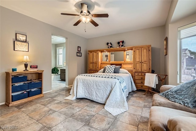 bedroom featuring multiple windows and ceiling fan