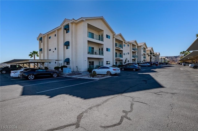 view of property with uncovered parking