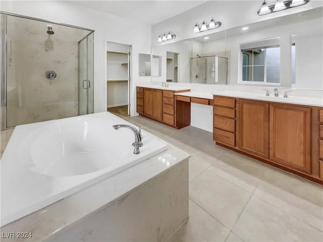 bathroom featuring separate shower and tub, tile patterned floors, and vanity