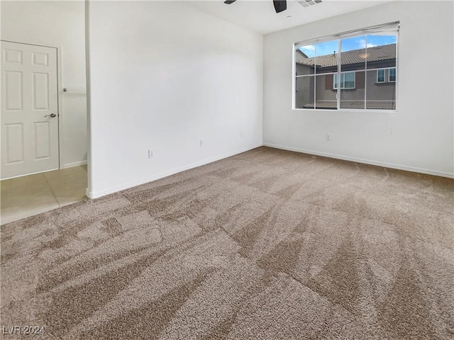 carpeted empty room with ceiling fan