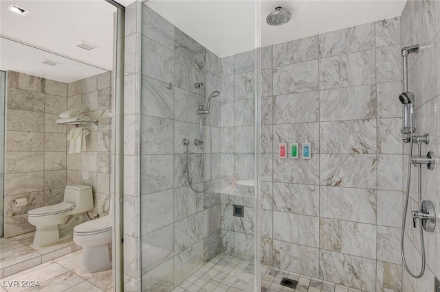 bathroom featuring a bidet, a shower with shower door, tile walls, and toilet