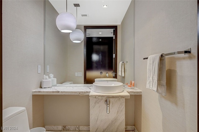 bathroom featuring sink and toilet