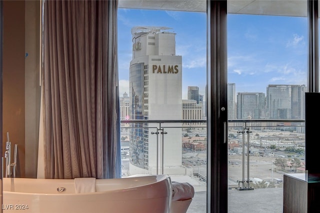 bedroom featuring floor to ceiling windows