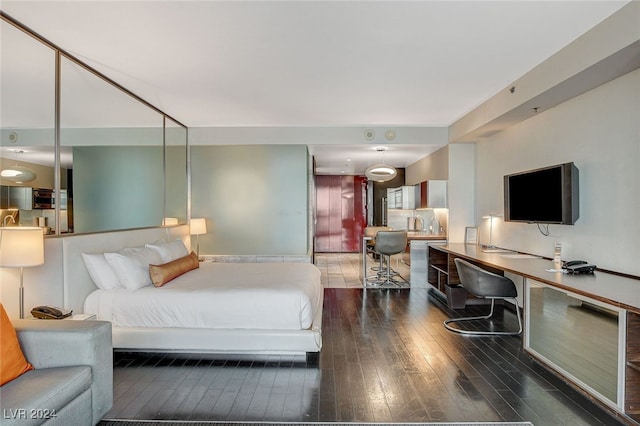 bedroom featuring dark hardwood / wood-style flooring