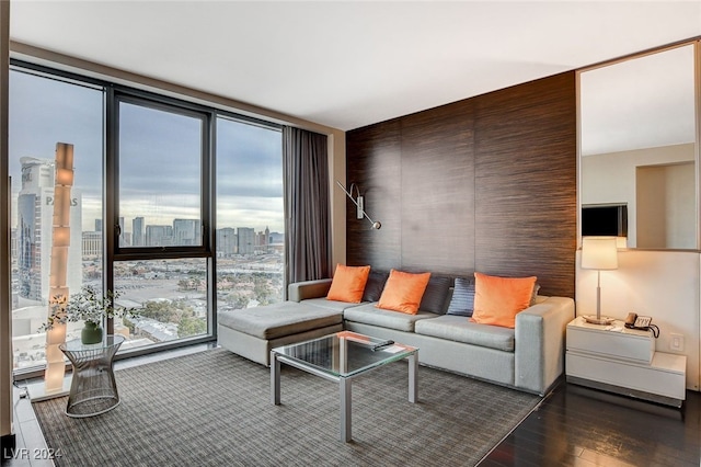 living room featuring dark hardwood / wood-style floors and floor to ceiling windows