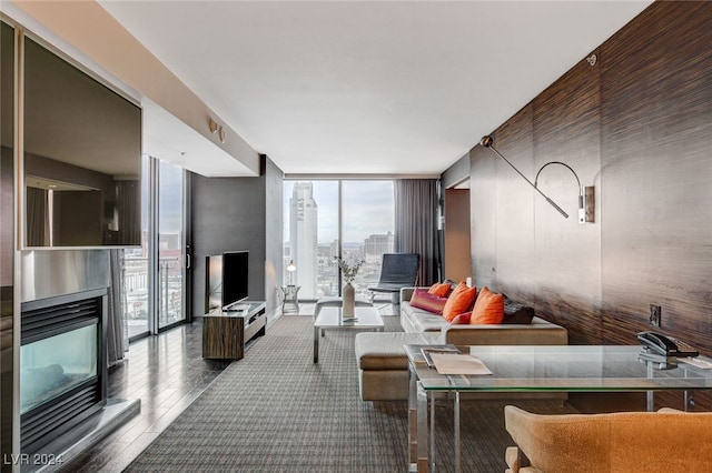 living room featuring floor to ceiling windows