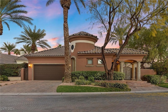 mediterranean / spanish-style house featuring a garage