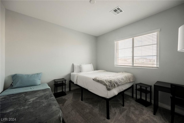 bedroom featuring dark colored carpet