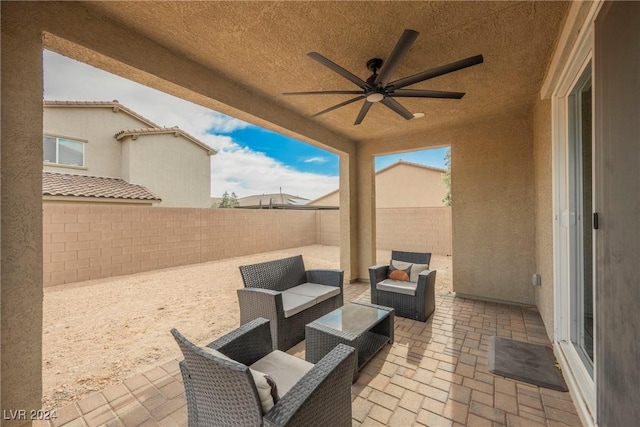 view of patio / terrace with ceiling fan and outdoor lounge area